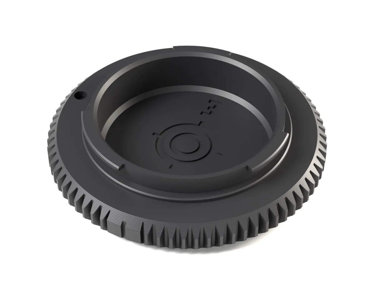 Sony E / FE body cap, 3D printed, seen from the camera side with its bayonet lugs and locking pin hole