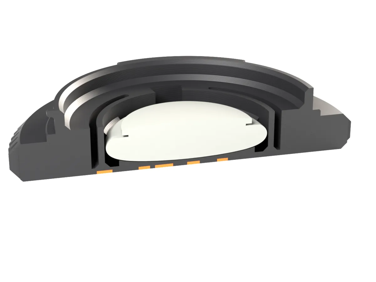 Cut through the Canon EF AirTag body cap: the AirTag held by the snap ring behind the face