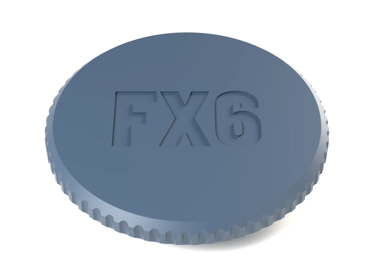 Canon EF body cap with the flutes grip and FX6 engraved into the face for one filament