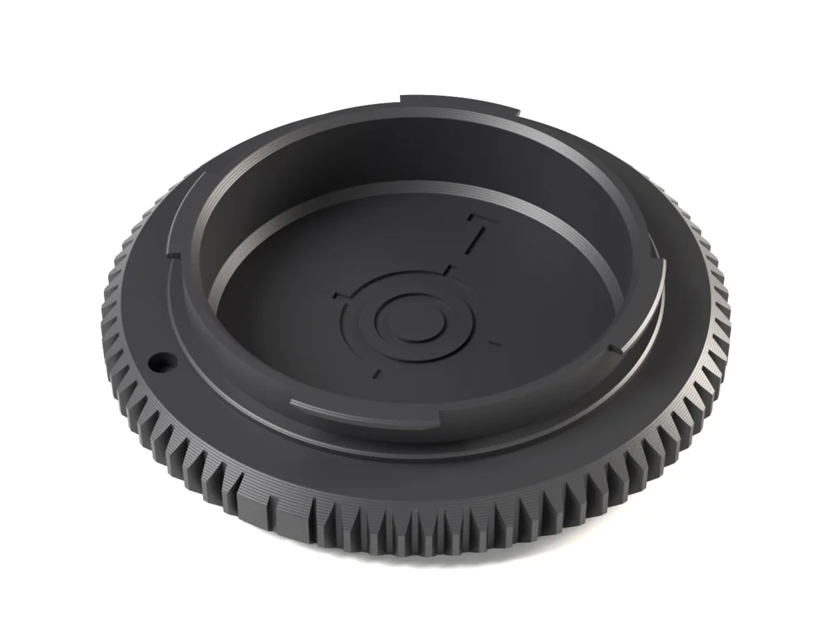 L-Mount body cap, 3D printed, seen from the camera side with its bayonet lugs and locking pin hole
