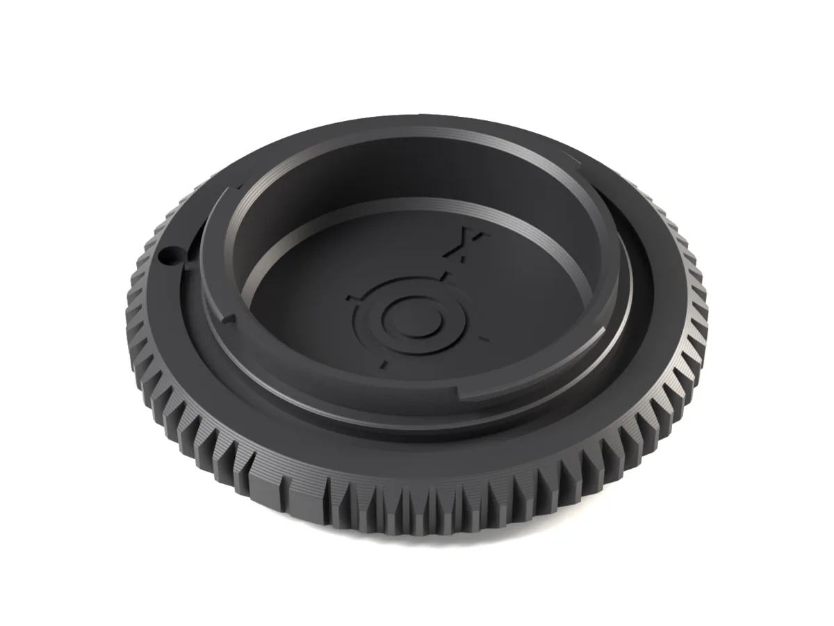 Fujifilm X body cap, 3D printed, seen from the camera side with its bayonet lugs and locking pin hole