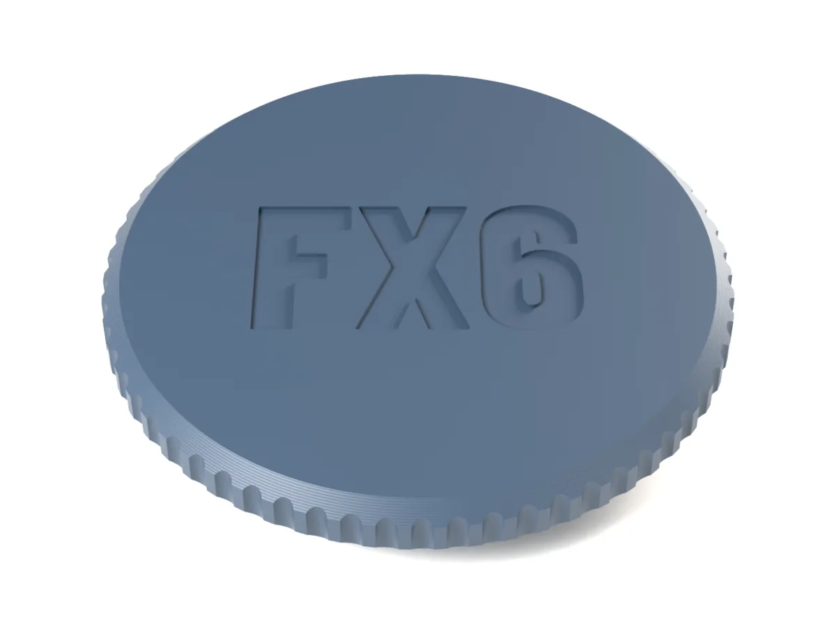 Nikon Z body cap with the flutes grip and FX6 engraved into the face for one filament