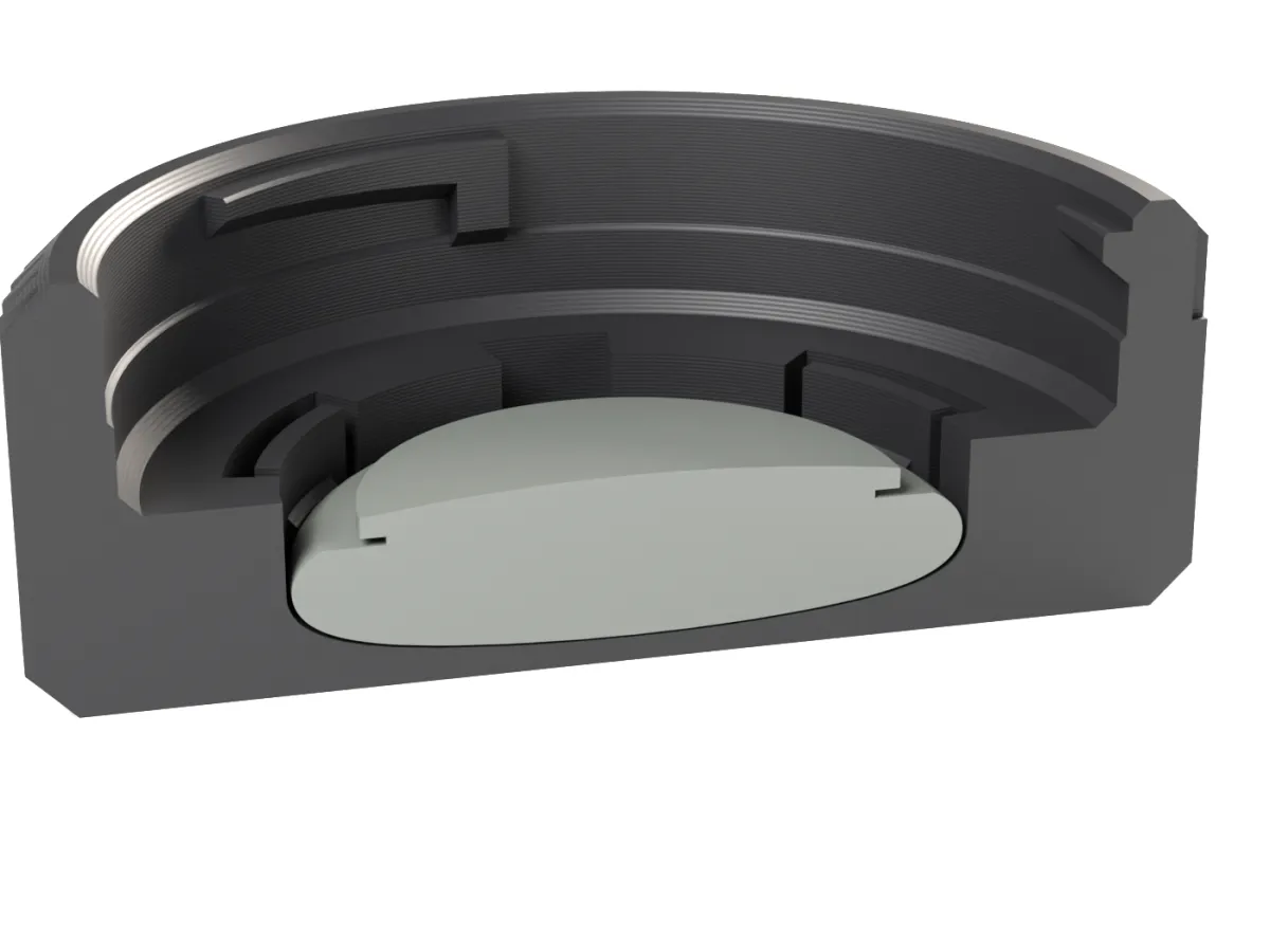 Cut through the Sony E AirTag rear cap: the AirTag held by snap tabs below the lens room