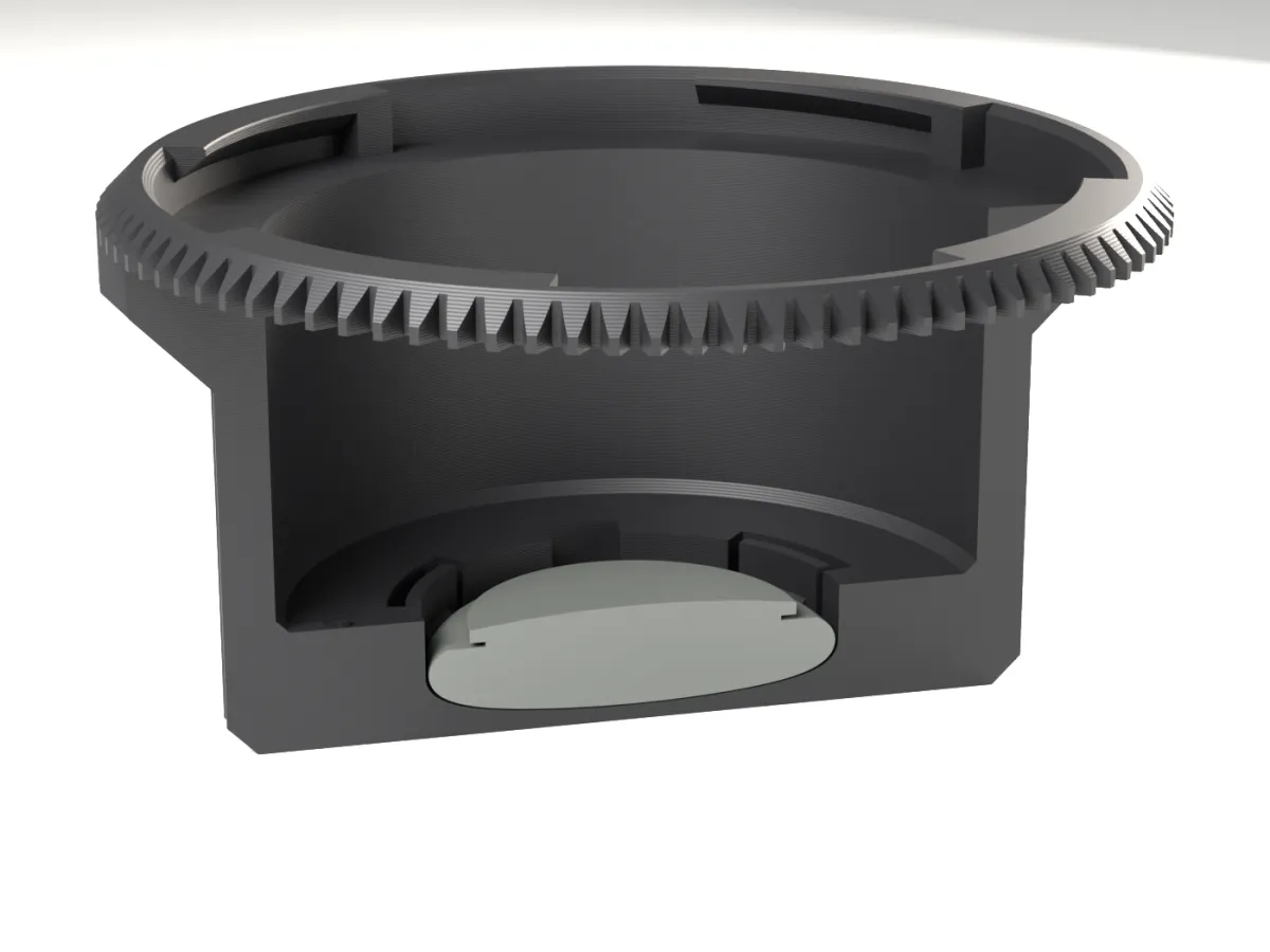 Cut through the ARRI PL AirTag rear cap: the AirTag held by snap tabs below the lens room