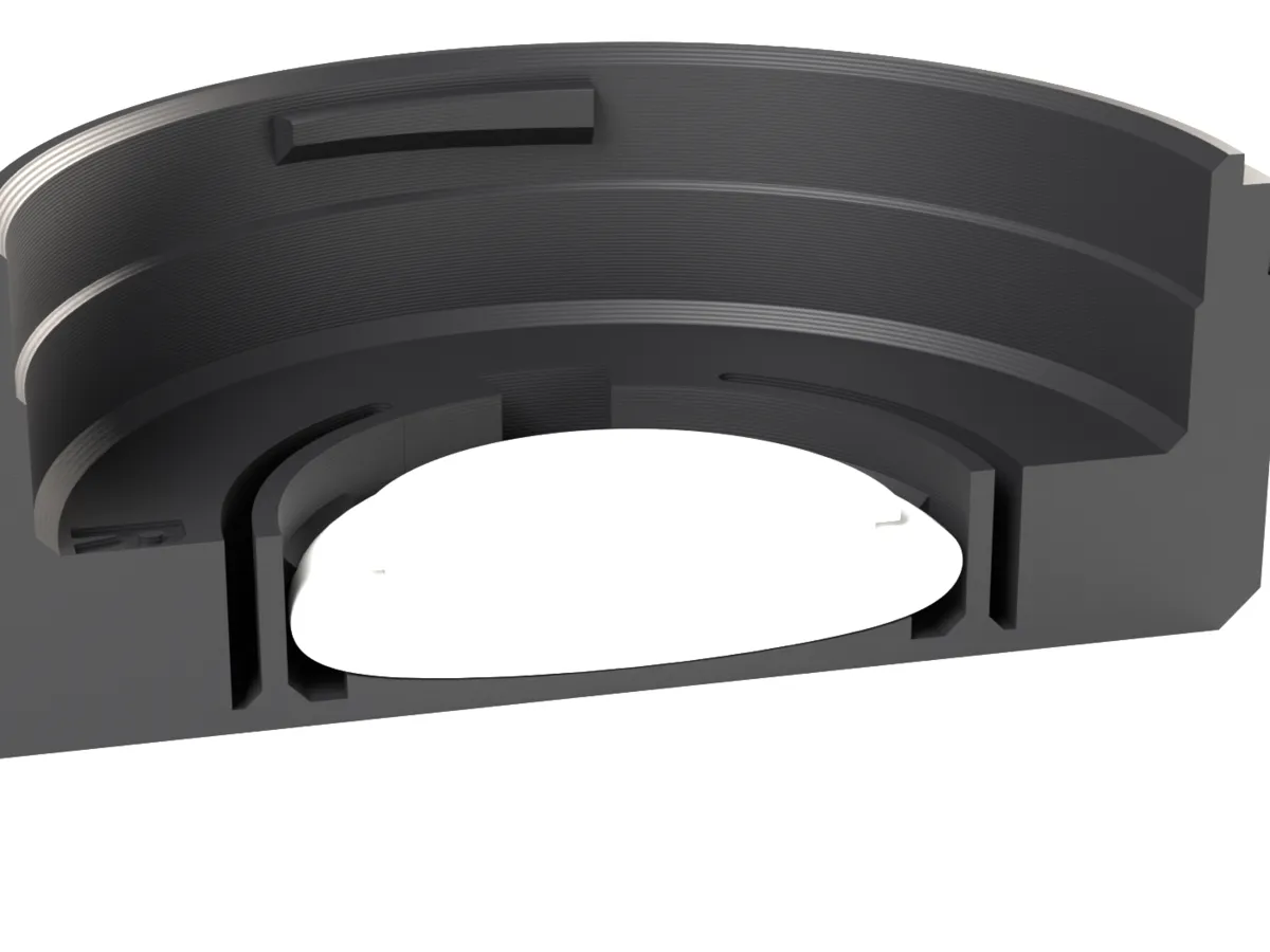 Cut through the Canon RF AirTag rear cap: the AirTag held by the snap ring below the lens room