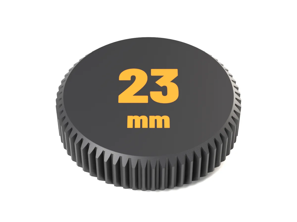 Face of the Fujifilm X rear cap with 23 mm as a flush two-colour inlay